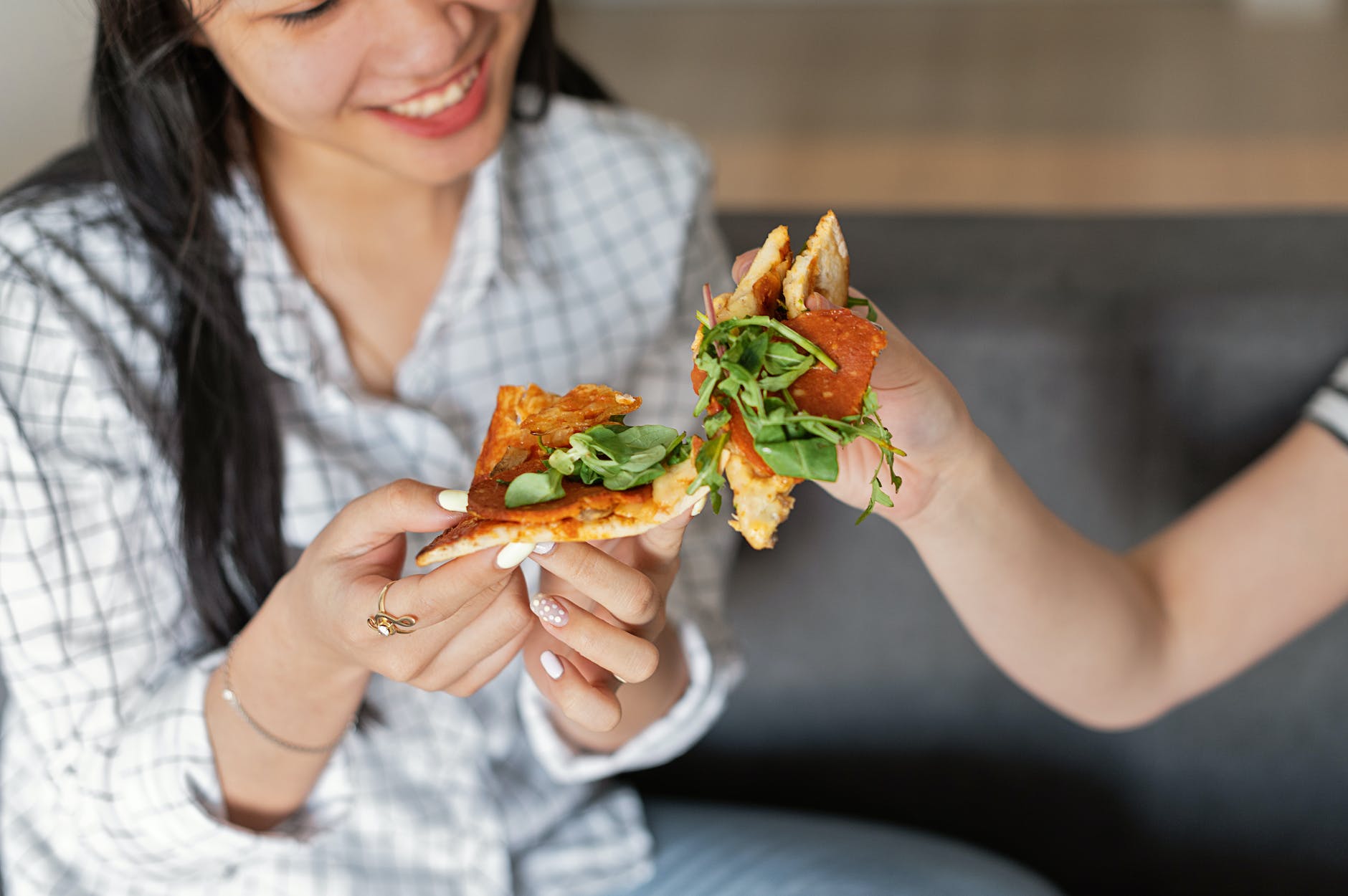 a woman eating a pizza