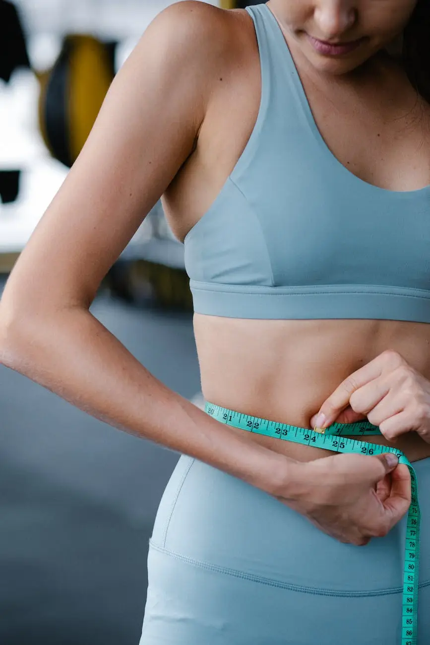 fit woman using measuring tape